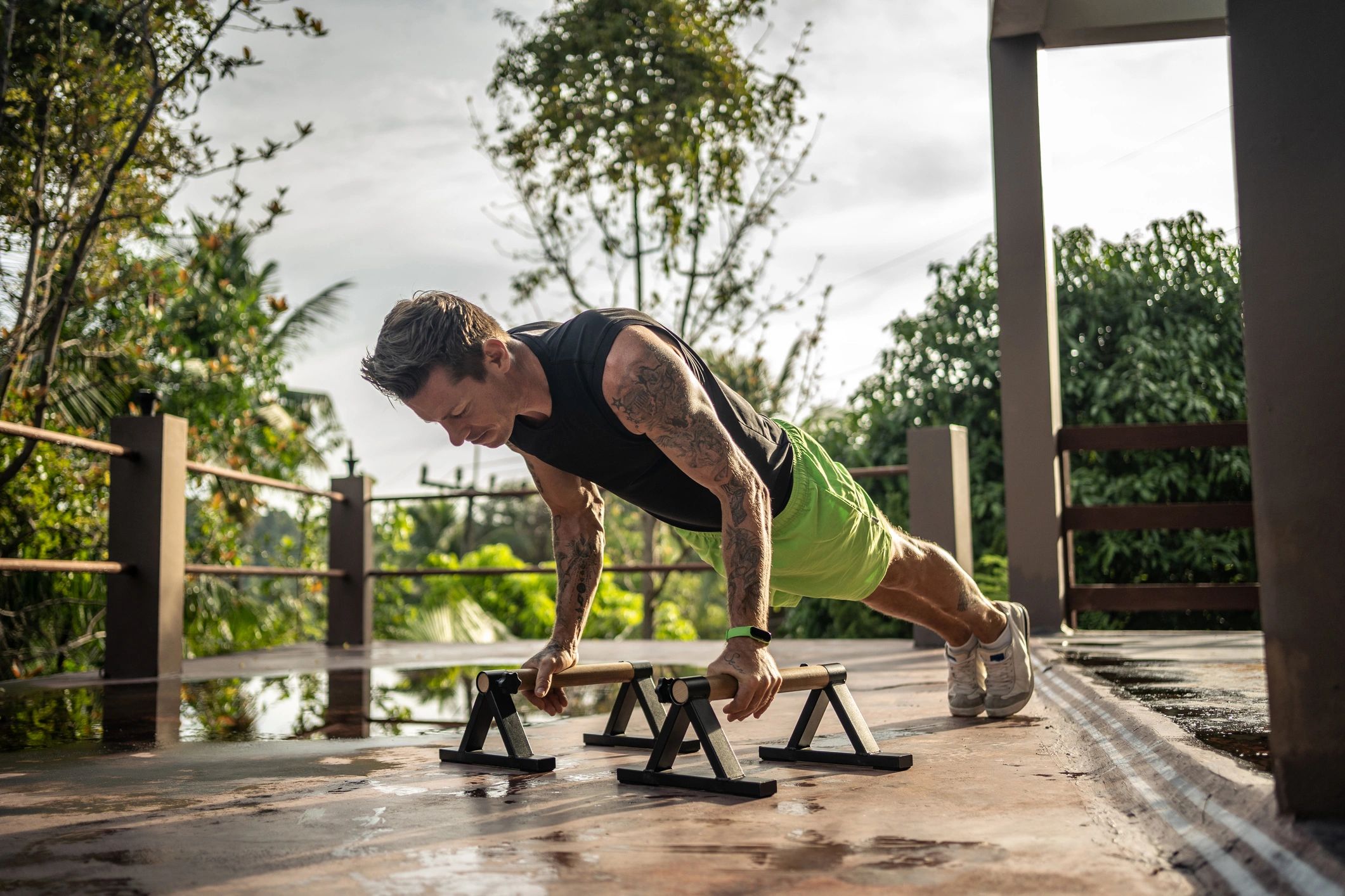 Man performing push-ups outdoors as part of a bodyweight strength training session