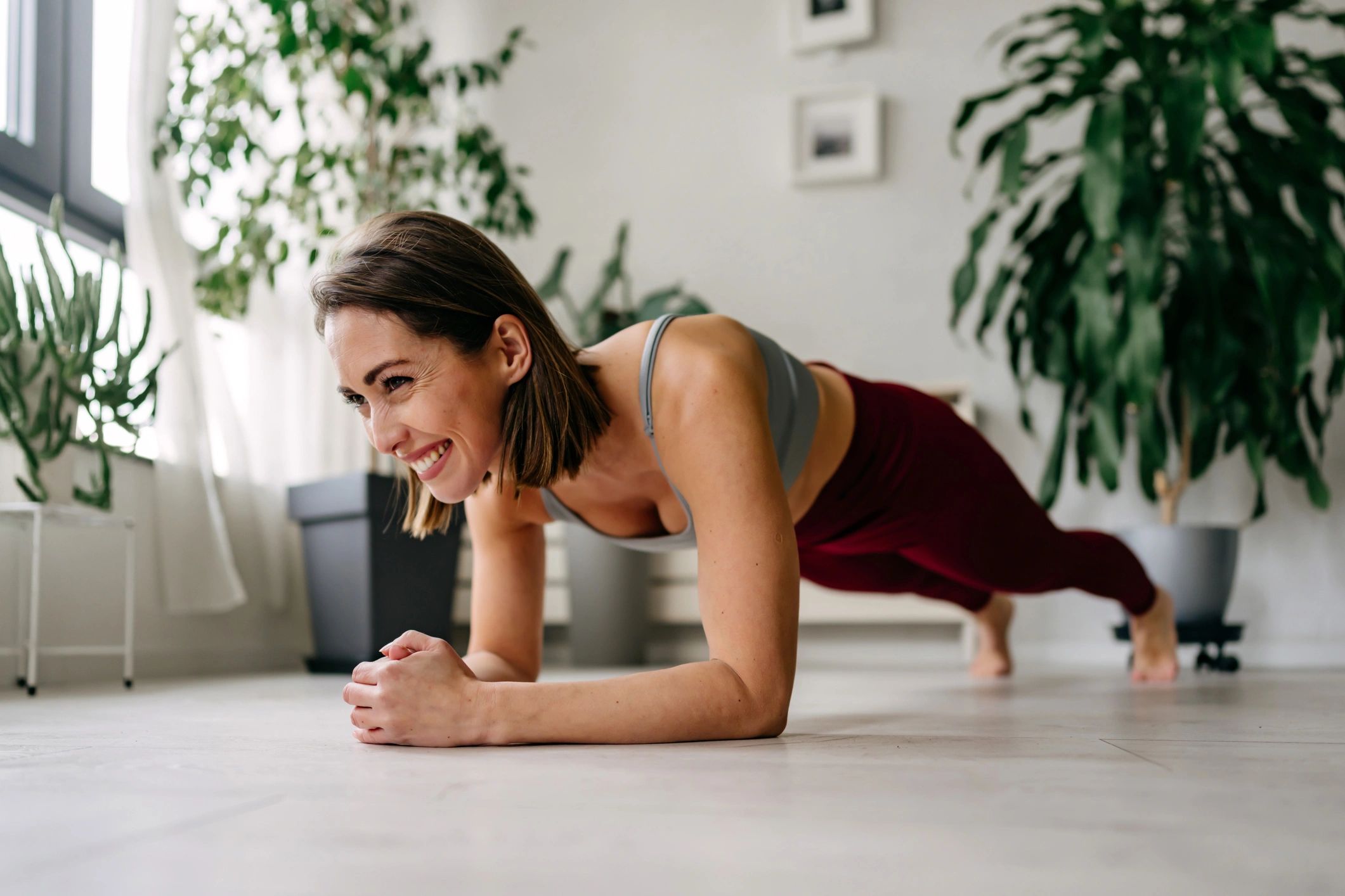 Woman holding a plank at home