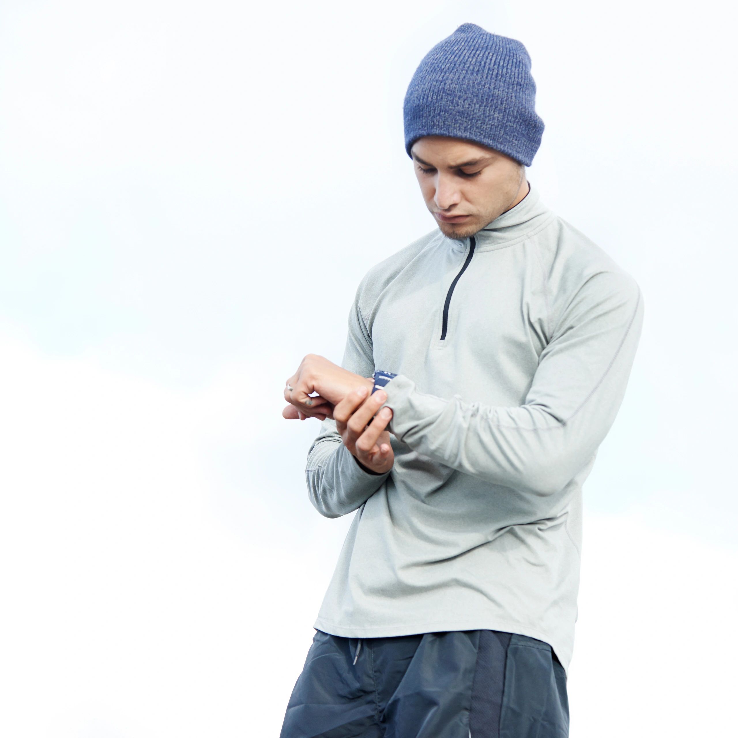 Jogger checking time outdoors